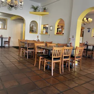 a dining room with tables and chairs