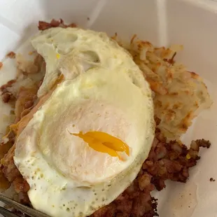 a fried egg and hash browns