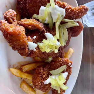 Tennessee chicken on a bed of fries