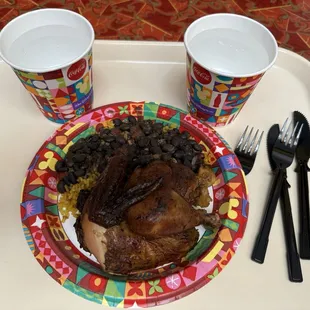 Overcooked chicken with rice and beans.