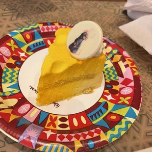 a slice of cake on a colorful plate