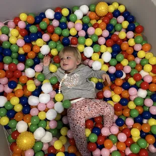 Keeley playing or I should say laying in the ball pit.