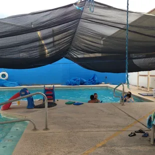 The pool including sun shade.