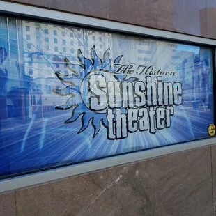 a sign for the sunshine theater