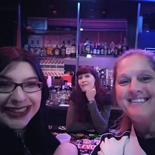 Pam, our bartender "Cookie" and me. Waiting for the Descendants show.