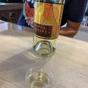 a glass of water and a bottle of wine