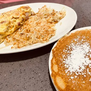 two plates of breakfast food