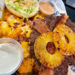 a tray of food including a burger and fries