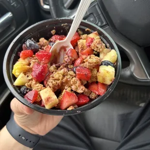 a bowl of fruit and granola