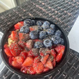 a bowl of strawberries and blueberries