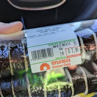 a person holding a package of food