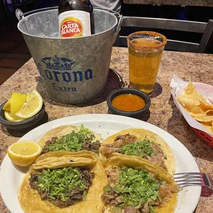 2 de Asada y 2 de Carnitas with a Carta Blanca