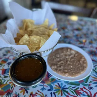 Complimentary chips, salsa and refried beans.
