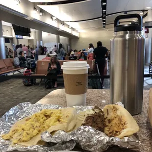 a plate of food and a cup of coffee