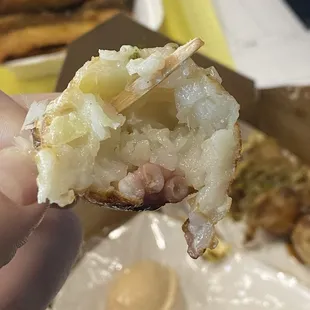 Very wet Takoyaki with raw dough flavors.