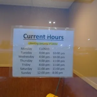 Hours of operation, front entry door.