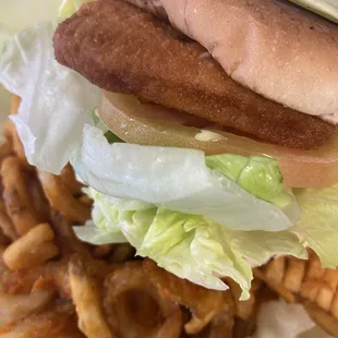 ALASKAN COD FISH  WITH TARTAR  SAUCE LETTUCE AND TOMATOS IF YOU  PAIR WITH CURLY FRYS BECOMES PERFECT COMBONATION