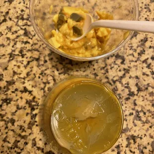 a bowl of liquid and a spoon