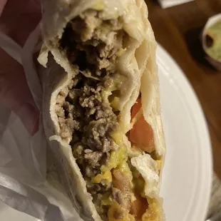 Ground beef, bean, and cheese burrito (add tomatoes and avocado)