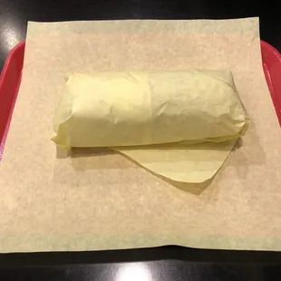 The "El Super" in classic yellow wrapping. It's a large burrito (look at that tray under there).