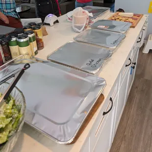 The large trays hold rice and beans, and the small trays hold 10-15 servings of meat. The complimentary salsas are in the plastic bag.