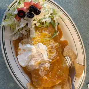 Wet burritos carnitas with green salsa flavor full and delicious