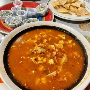 a bowl of soup with tortillas and tortillas