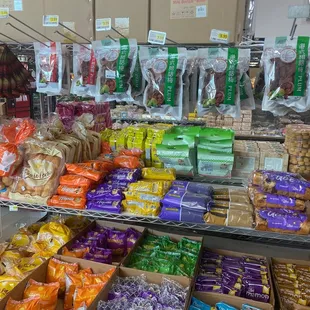 a variety of snacks on display in a grocery store