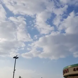 a cloudy sky over a chinese restaurant