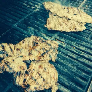 'Flap meat' with marinade on the grill for tacos.