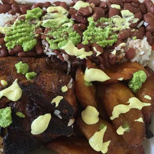 a plate of food with beans and rice