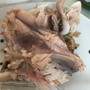 a piece of meat on a plate with a fork