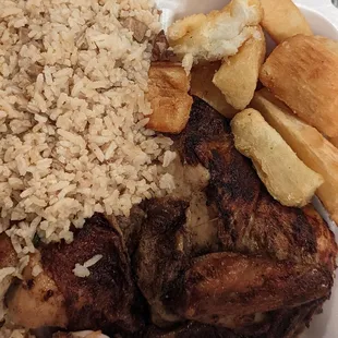 a plate of food with rice and french fries