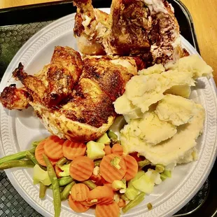 Half of the Peruvian chicken with a side of mashed potatoes and steamed veggies - YUMMY!!!