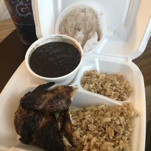 1/4 Chicken white meat with fried rice and black beans.