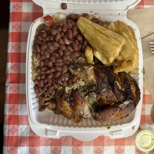1/2 Chicken White Meat  Sides: Fried Yucca and Chaufa Rice with pinto beans on top