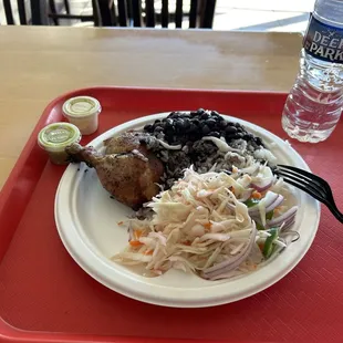 1/4 Chicken - Dark Meat with Spicy Cabbage and beans and rice.
