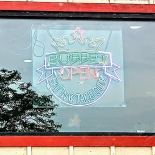 Super China buffet neon window sign.