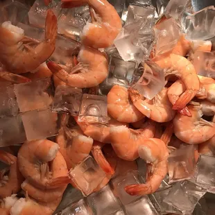 a pile of shrimp on ice