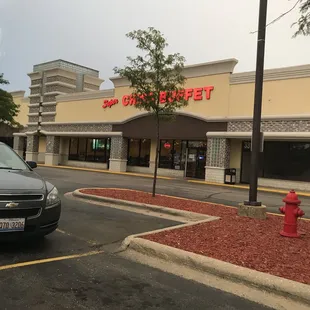 a car parked in front of a restaurant