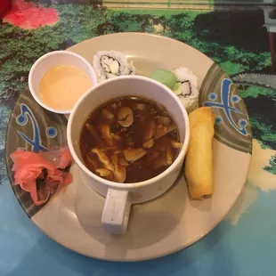 a bowl of soup and a roll