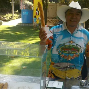 Hipolito with Olimpos churros serving up the best churros ever!