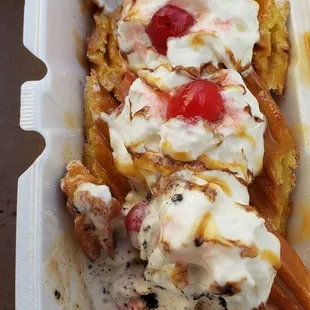 Churro split with cookies and cream, strawberry, vanilla ice cream