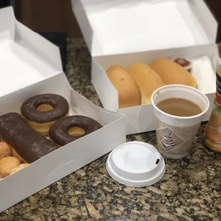 a variety of doughnuts and coffee