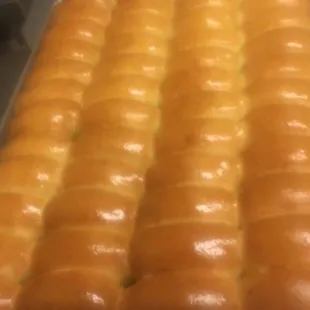 a pan of doughnuts on a baking sheet
