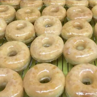 glazed donuts on a cooling rack
