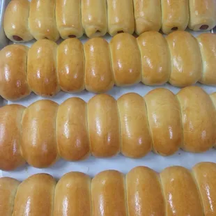 rows of doughnuts in a baking pan