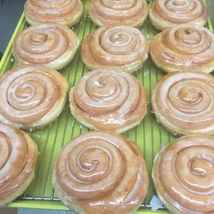 a tray of glazed donuts