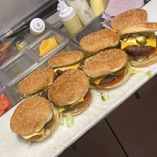 a row of hamburgers on a counter