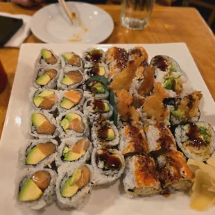 a plate of sushi rolls